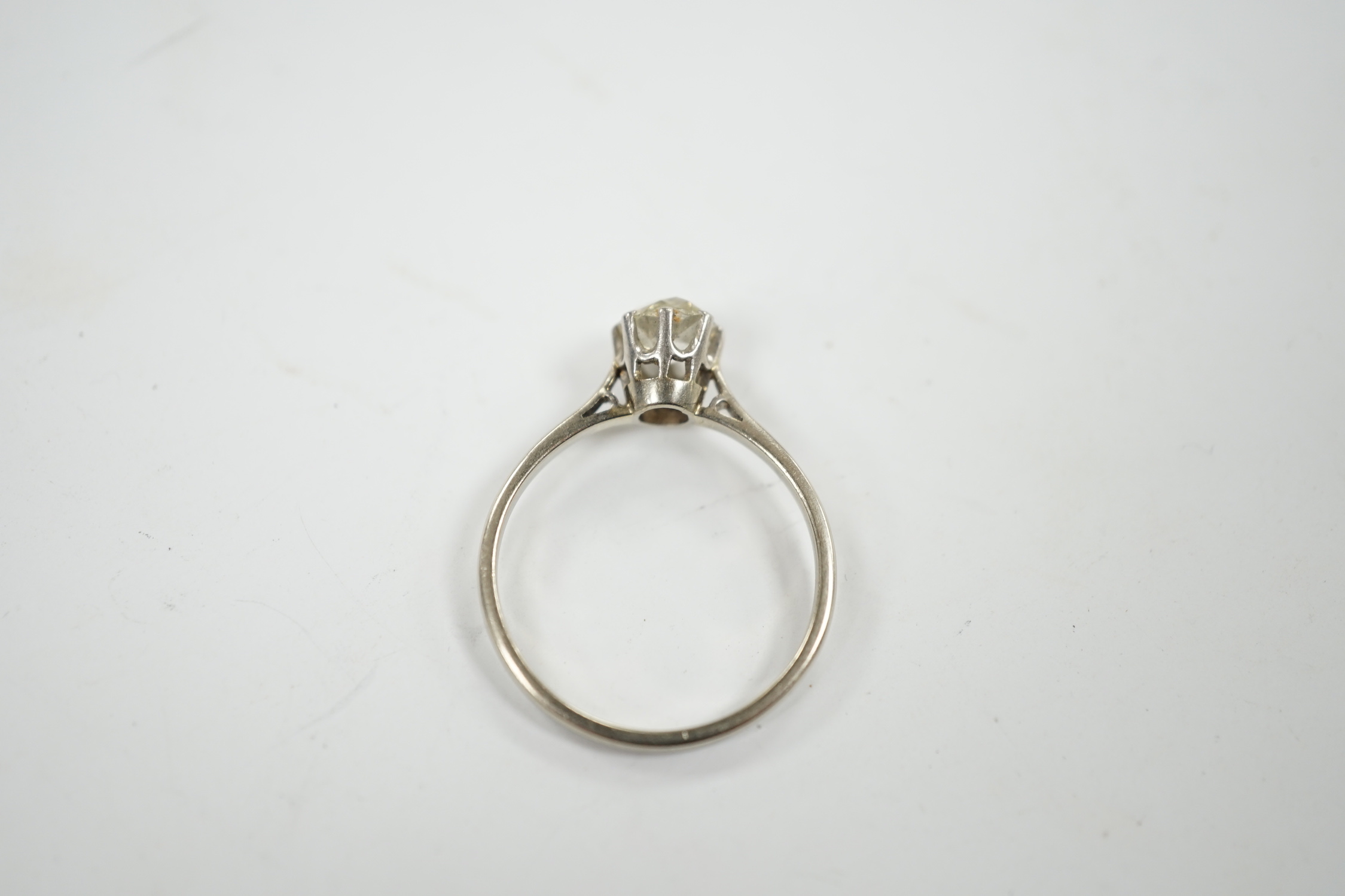 A white metal and solitaire diamond set ring, size Q, gross weight 2.1 grams